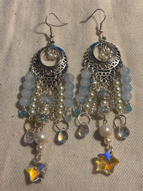 Close-up of crystal sky petal earrings showing crystal detail